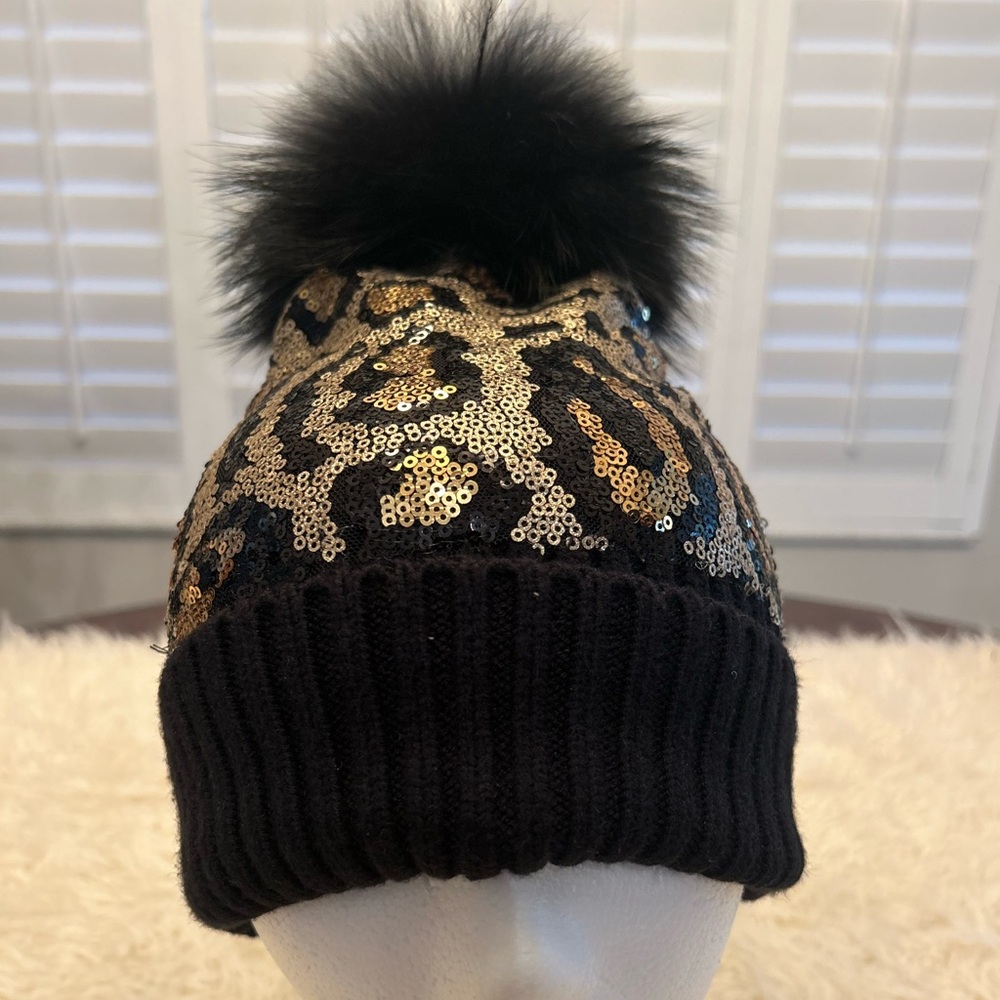Bari Lynn rib knit hat w/gold sequins animal pattern front and fur pom